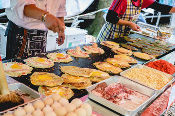 Cooking okonomiyaki pancakes, at Aoi Matsuri celebrations, Kyoto