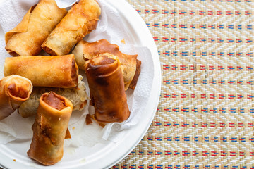 fried spring roll rice paper vegetables shrimp quick snack asia thailand malaysia full plate close-up