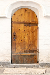oak old door on a white facade opening background closed design urban old architecture