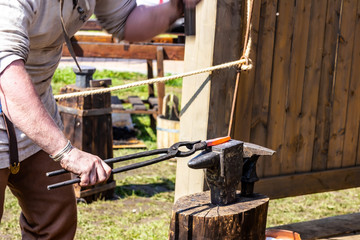 smithy outdoor heated metal on an anvil shaping articles traditional art