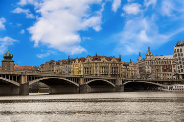 panorama to the old part of the city famous building of Prague dancing house two cylindrical towers symbol of a dancing couple  on the bank of the river of Vaclav