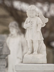 statue of angel on cemetery