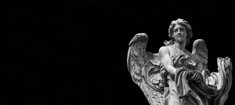 Angel statue holding the garment and dice of Jesus Passion. A 17th century baroque masterpiece at the top of Sant'Angelo Bridge in the center of Rome (Black and White with copy space)