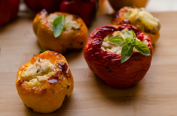 peppers stuffed with chicken with potatoes and spices. red green, yellow, vegan food