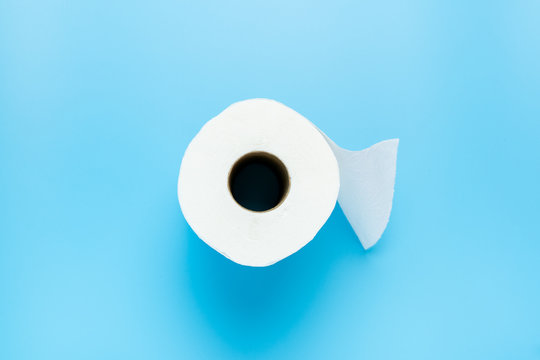 One toilet paper roll isolated on blue background