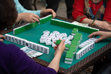 people playing mahjong in a tea garden in china - obrazy, fototapety, plakaty