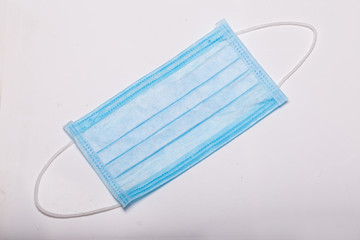 Protective medical mask isolated on a white background. Protective masks as precaution in spread of coronavirus Covid-19