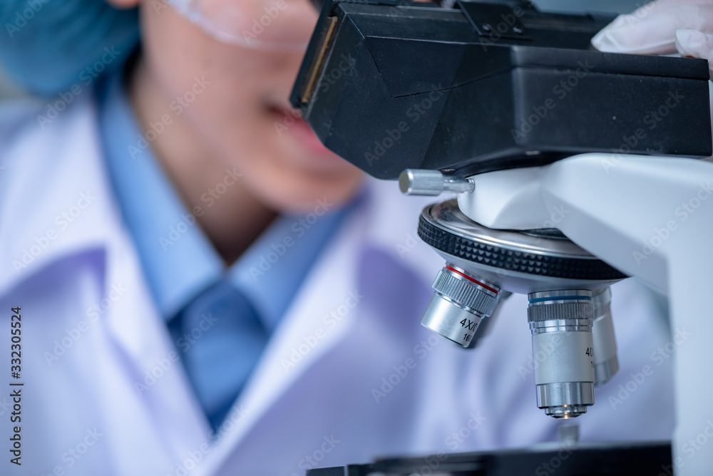 Wall mural closeup of scientific microscope data analysis in the laboratory