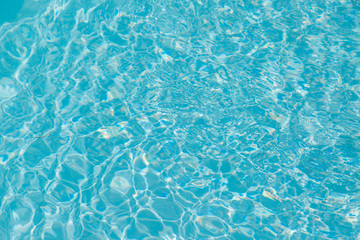 Blue water ripple reflection in the swimming pool