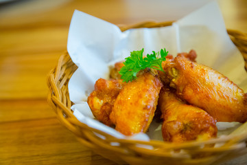 Chicken wings barbecued in a basket