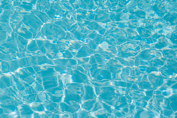 Blue water ripple reflection in the swimming pool