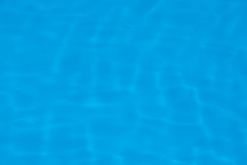 Blue water ripple reflection in the swimming pool