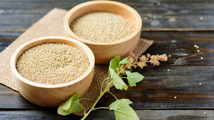 Organic raw brown quinoa seed in wooden bowl, healthy food