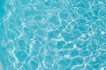 Blue water ripple reflection in the swimming pool