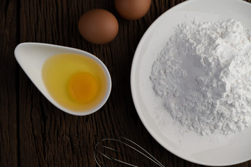 Eggs, tapioca flour and an egg beater, ingredients used in bakery
