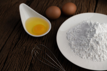 Eggs, tapioca flour and an egg beater, ingredients used in bakery