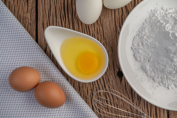 Eggs, tapioca flour and an egg beater, ingredients used in bakery