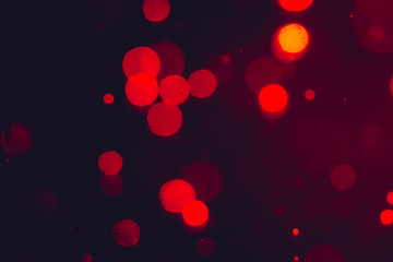 Dark Abstract Red bokeh sparkle on black background