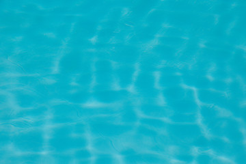 Blue water ripple reflection in the swimming pool