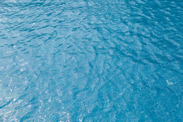 Obraz premium Blue water surface in the swimming pool