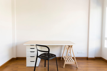 working space with wood table and chair in white empty room.