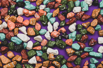 Candy pebbles background. sweets in the form of colored stones