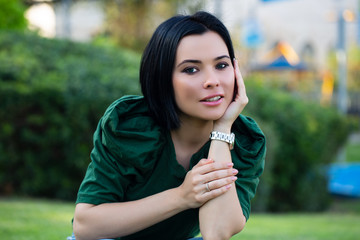 Attractive woman with short hair being very glad smiling with broad smile showing her perfect teeth having fun outdoors. Joyful excited female rejoicing after being proposed to marry. 