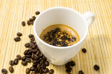 cup of coffee with coffee beans