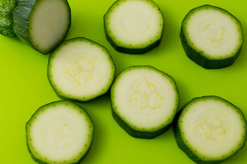 fresh green zucchini slices on green