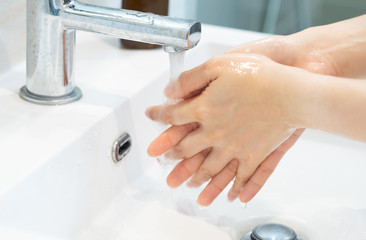 washing hands in the bathroom