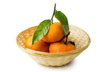 mandarin with leafs in basket