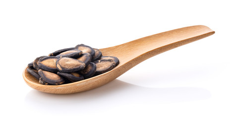 watermelon seed in wood spoon on white background