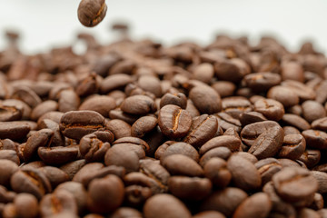 coffee beans close up on a white isolated background,copy space.