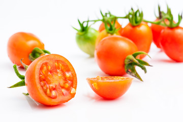 fresh red cherry tomatoes (grape tomatoes ) on white background.