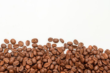 Naklejka premium coffee beans close up on a white isolated background,copy space.