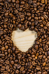 Roasted coffee beans with heart form