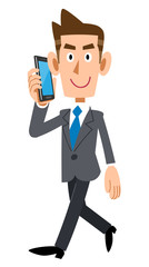 歩きながら電話で会話するビジネスマン