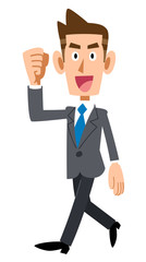歩きながら笑顔でガッツポーズするビジネスマン