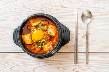 ‘Kimchi Jjigae’ or Kimchi Soup with Tofu and Egg or Korean Kimchi Stew