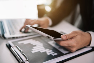 Business hand using smart phone, mobile p payments online shopping, omni channel, digital tablet at office in the morning.