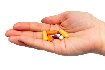 colorful medical pills, tablets in hand isolated. Drug protection, treatment of viruses, antiviral, diseases concept.