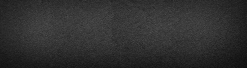Ultra wide rough black surface. Panoramic background with darkened edges. Texture of flat and grainy sandpaper or panorama of uneven wall material. - obrazy, fototapety, plakaty
