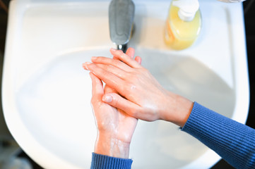 Wash hands with soap after outside. Corona Virus or bacteria is infected by protection against touching a public object. Customer self-defense in a public place concept.