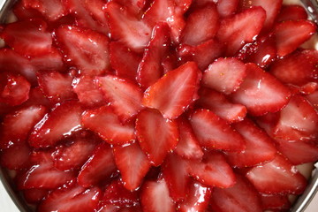 Sliced strawberry topping. Making frozen strawberry cheesecake series.
