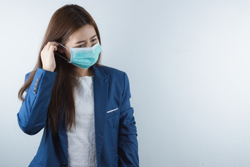 The business woman wearing protection face mask against coronavirus, PM 2.5 and cold. Coronavirus and Air pollution pm 2.5 concept.