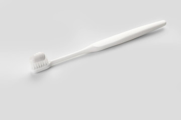 Tooth brush with paste on white background
