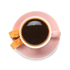Cup of hot coffee and cookies on white background