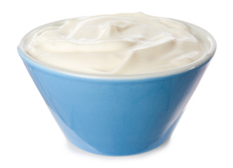 Bowl with tasty sour cream on white background