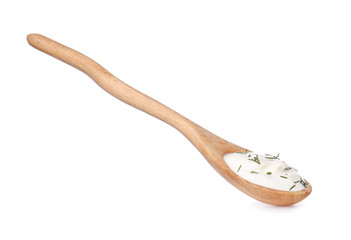 Spoon with tasty sour cream on white background