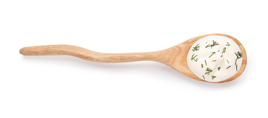 Spoon with tasty sour cream on white background